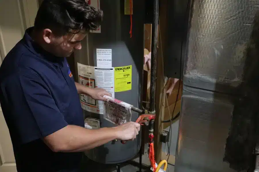 Plumber installing a gas line in a residential home in Acworth, GA