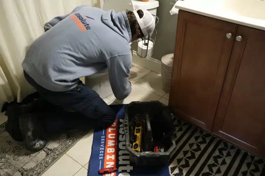 Plumber fixing a toilet in Acworth, GA