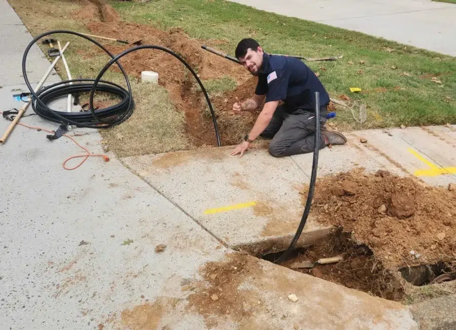 Absolute Plumbing services technician performing trenchless sewer repair in Acworth, GA