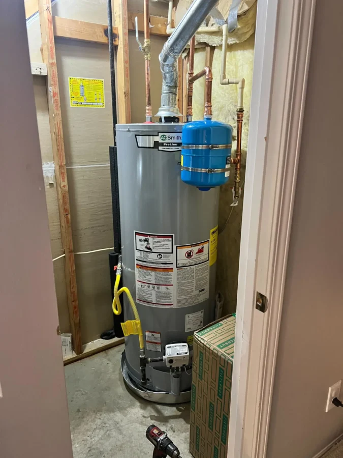 water heater with expansion tank in a utility closet after receiving water heater maintenance in Acworth, GA